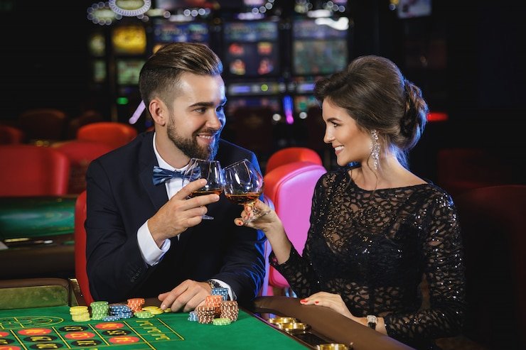 Professional dealer at blackjack table with dewa777 slot branding